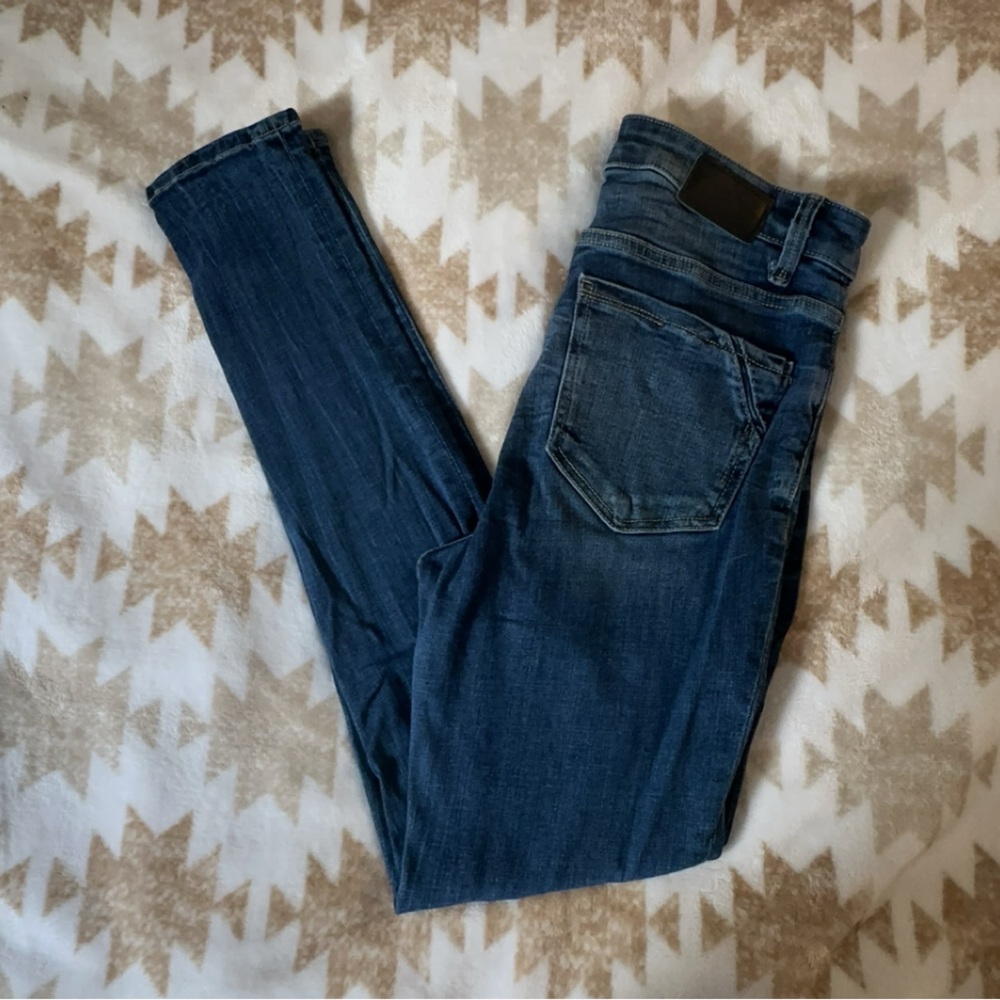 buckle black skinny jeans